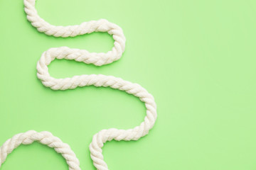 Long rope on color background