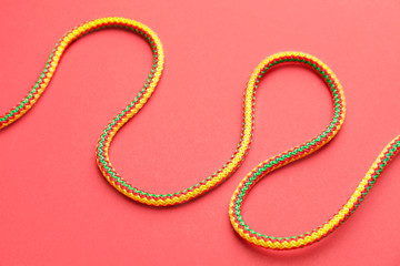 Long rope on color background