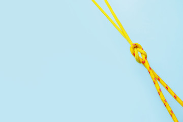 Ropes with knot on color background