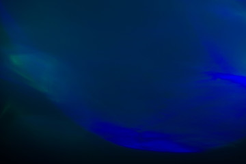 Fototapeta premium Blurred lens flare. Defocused colorful lights. Shiny glowing spots, abstract background and texture