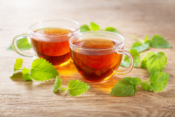 cups of tea with mint leaves