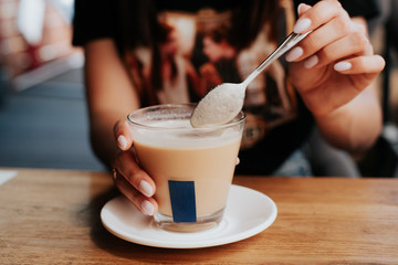 girl holding a cup of coffee