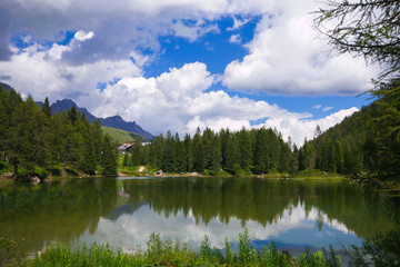 Fototapeta na wymiar Panoramic view of San Pellegrino lake in the San Pallegrino pass in Trentino, Italy