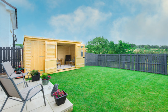Modern Garden Designed and landscaped with newly Constructed Materials Including New Summer House Silver Copse painted Fencing and New Laid Turfing.