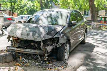 Kyiv (Kiev), Ukraine - August 08, 2020: A burned-out and broken new modern and beautiful car, vehicle