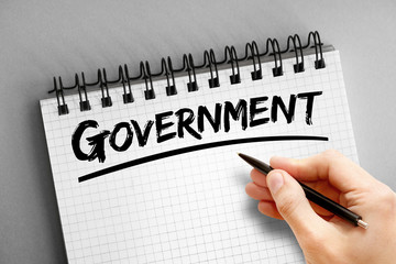 Government text on notepad, business concept background
