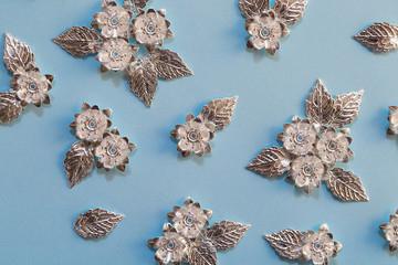 Beautiful silver plated details for creating jewelry, sewing and clothing design. Metal flowers and...