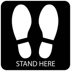 Social distancing concept for preventing coronavirus covid-19 with white footprint and wording stand here in black background