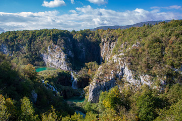 Incredible, huge waterfalls in the beautiful, famous Plitvice Lakes, Croatia during bright, sunny summer day