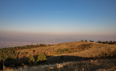 Hills of Nagy-S&eacute;zn&aacute;s, a Hungarian mountain just before sunset, with lots of yellow grass everywhere,
