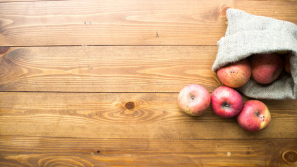 ripe apples on a wooden background