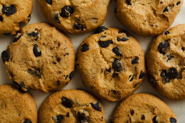 Closeup of cookies with chocolate as a background.Tasty biscuits for snack