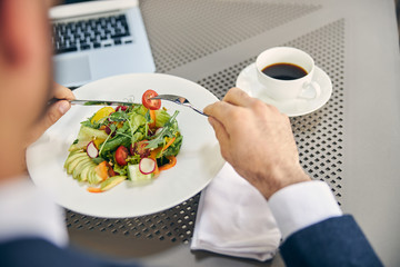 Close up of businessman enjoying his dinner