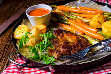 grilled neck chops with caramelized vegetables.
