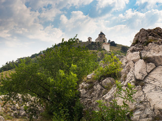Naklejka premium Holy Hill with white building of Saint Sebastians Chapel. Medieval, church. Mikulov, Czech republic, South Moravia
