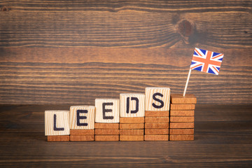 LEEDS. City in Great Britain. Development, growth, policy and taxation concept. Steps and flag