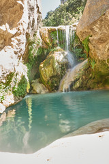 Naklejka premium Waterfalls of the Guadalquivir river as it passes through the Utrero enclosure in the Sierra de Cazorla, Segura and Las Villas Natural Park. Jaen. Andalusia. Spain