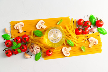 Set of products for cooking Italian pasta with mushrooms on a light gray background. Flat lay.