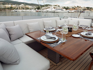 Aboard of a super sailing yacht. At the deck. Luxury. Leisure. Sailing.  Set table luxurious. Palma de Mallorca Spain.