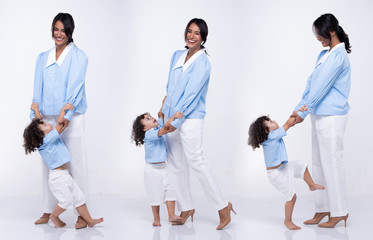 Asian Mother Caucasian Daughter Little girl hold mom hand and smile with love