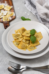 Roasted ravioli with basil.  top view, recipe  Italian cuisine. 