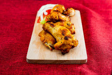 Chicken Wings Spicy chicken wings, breaded, fried, cooked.