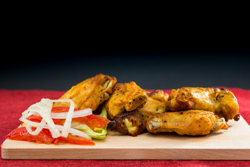 Chicken Wings Spicy chicken wings, breaded, fried, cooked.