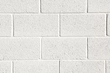 Fototapeten Konkrete Close up of white painted concrete block wall background texture  © Helen Davies