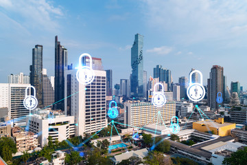Obraz premium Padlock icon hologram over panorama city view of Bangkok to protect business in Asia. The concept of information security shields. Double exposure.