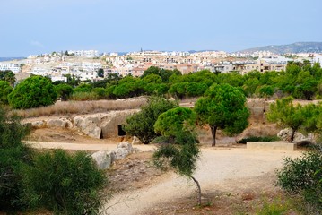 View of an ancient Tomb of the Kings necropolis with underground cave like graves in the city of Paphos (Pafos), Cyprus