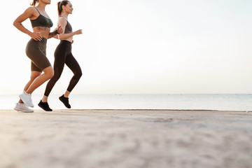 Fitness sports women friends running outdoors