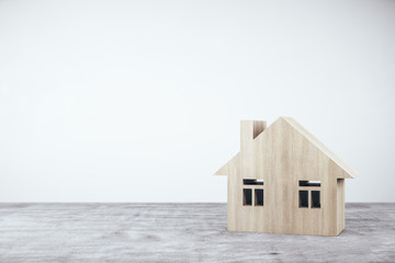 Wooden house on concrete table.