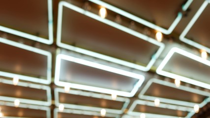 Defocused old fasioned electric lamps glowing at night. Abstract close up of blurred retro casino decoration shimmering, Las Vegas USA. Illuminated vintage style bulbs glittering on Freemont street