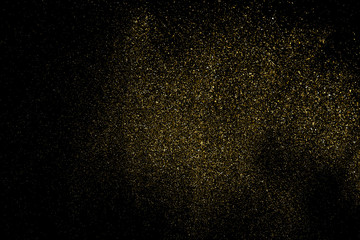 Gold Glitter Texture Isolated on Black Background. Golden stardust. Amber Particles Color. Sparkles Rain. Vector Illustration, Eps 10.