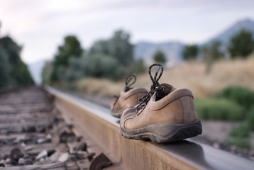 Walking the rails with shoes on.