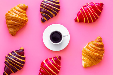 Set of coffee with croissants - chocolate, berry, classic - on pink top view