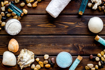 Fototapeta na wymiar Frame of wellness set of spa cosmetics with sea salt and stones