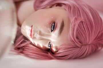 Portrait of a sexy young woman with pink hair. Perfect hairstyle and hair coloring. Girl with...