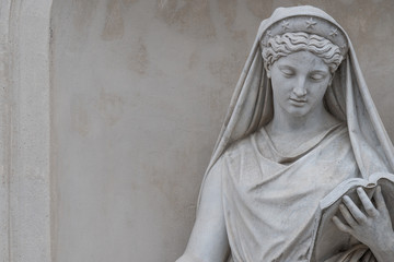 Portrait of old park statue of sensual Italian or Greek Renaissance Era woman in historical downtown city park in Potsdam, Germany
