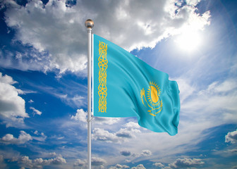 Realistic flag. 3D illustration. Colored waving flag of Kazakhstan on sunny blue sky background.