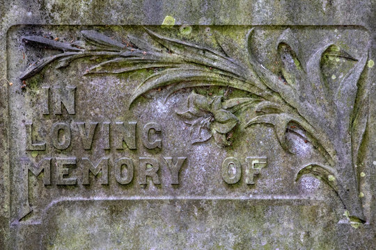 In Loving Memory Of - Written On A Headstone In A Graveyard.