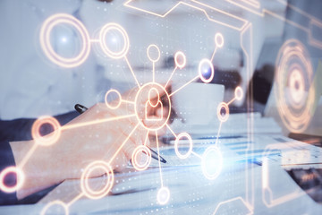 Man's hands working with notes background. Social networking scheme . Mixed media