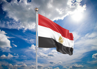 Realistic flag. 3D illustration. Colored waving flag of Egypt on sunny blue sky background.