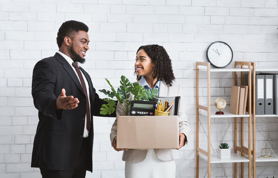 First Day At Office. African American Businessman Welcoming New Female Employee To His Team At Office