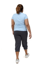 rear view of a woman with sportswear walking on white background,