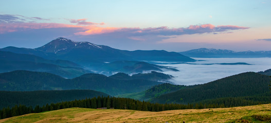 Fototapeta premium Spectacular autumn evening over mountain meadow. Carpathian Mountains, Ukraine.