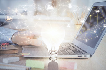 Social network theme hologram with businessman working on computer on background. Concept of world...