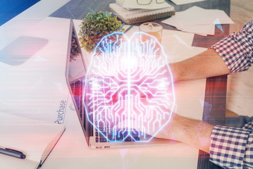 Man with computer background with brain theme hologram. Concept of brainstorm. Double exposure.