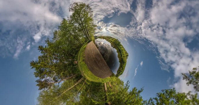 Curvature of space of little planet transformation. Abstract torsion and spinning of full flyby panorama landscape near river and forest in sunny day
