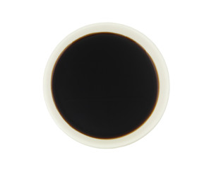 Soy sauce in white bowl isolated on white, top view
